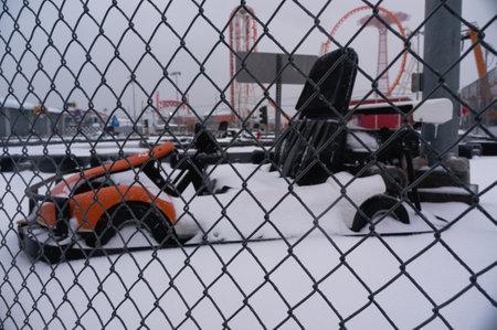 A scenic shot of a kart car under the snow in an amusement parkの写真素材