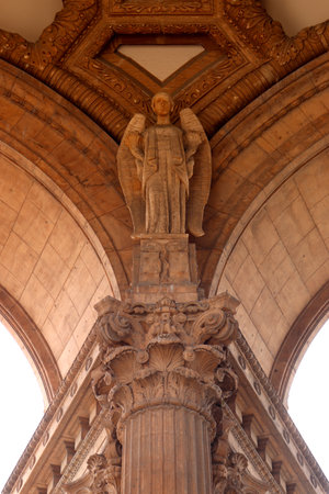 A vertical shot of beautifully carved arches and an angel sculpture in the Palace of Fine Arts, San Franciscoの写真素材