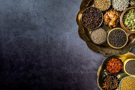 A top view of Indian seasonings and spices on a tableの写真素材