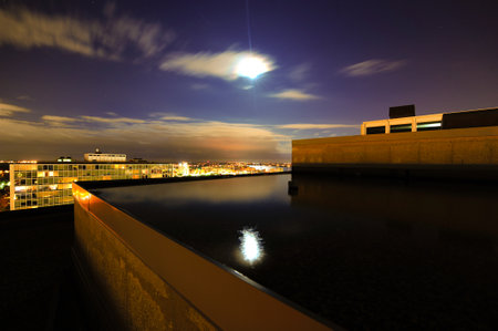 A scenic view of buildings in a city during the nightの写真素材