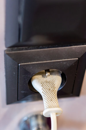 A closeup shot of a plug in a socket