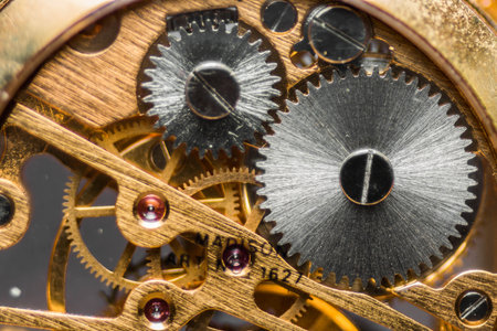 A closeup detail of the internal mechanism of a vintage analog clockwork
