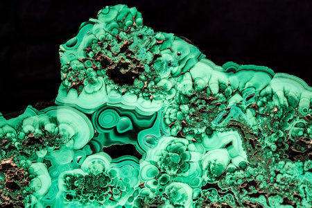 An abstractly shaped green piece of quartz stone under bright lightingの写真素材