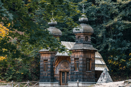 A scenic view of the wooden Russian Orthodox chapel on Vrsic mountain pass in Sloveniaの写真素材