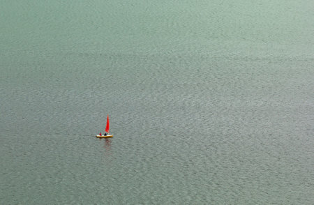 A beautiful view of a boat on a calm lakeの写真素材