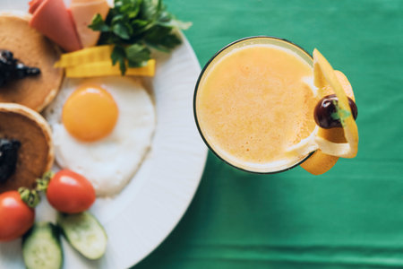A top view of a glass of juice with lemon on a table for breakfastの写真素材