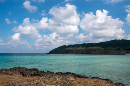 A beautiful shot of a sunny day on Hamdeok Beach on Jeju Islandの写真素材