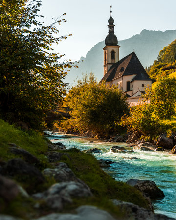 A vertical shot of the Pfarrkirche Saint Sebastian church, Ramsau bei Berchtesgaden, Germanyの写真素材