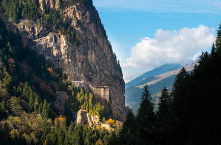 A beautiful view of castles in a landscape with large trees and cliffs
