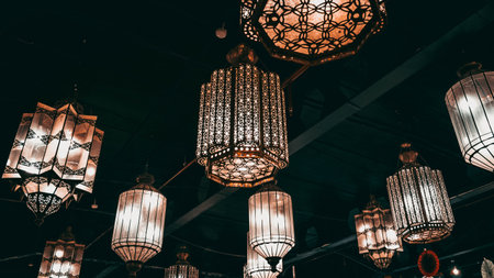 A low angle shot of some vintage lamps hanging from the ceiling