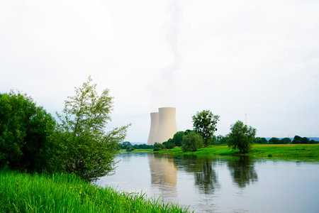 A nuclear power plant in Grohnde with cooling towers and surrounding landscapeの写真素材