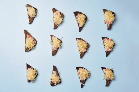 A top view shot of a bunch of toasts on a blue background