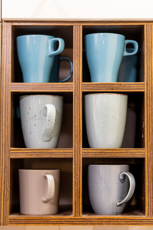 Some cups on a shelf for cupsの写真素材
