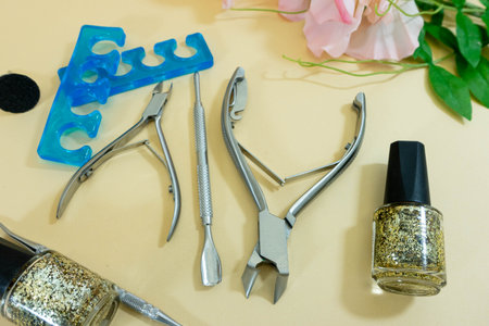 Set of manicure and pedicure tools on beige background.の写真素材