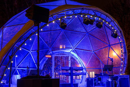 Concert venue in a blue transparent dome or bubble tentの写真素材