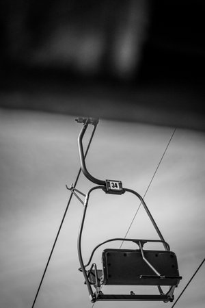 A grayscale shot of an old ropeway