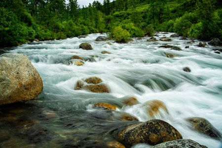 A beautiful view of Little Susitna River cascading over rocks in Alaska, USA