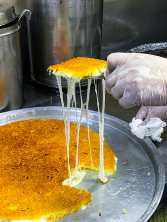 Preparation of Knafeh or Kanafeh, a traditional Middle Eastern dessertの写真素材