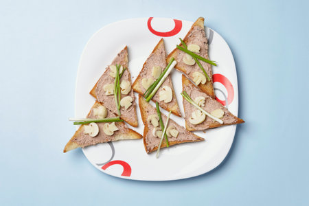 A top view shot of a bunch of toasts on a blue background