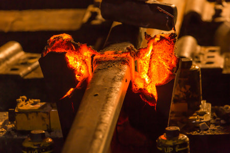 A close-up shot of railroad rail hot weld