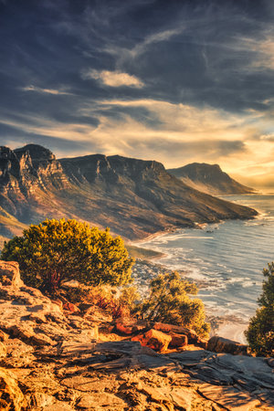 A vertical shot of the coast of Camps Bay in Cape Town, South Africa at duskの写真素材