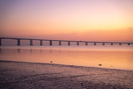 A beautiful view of a bridge on the water
