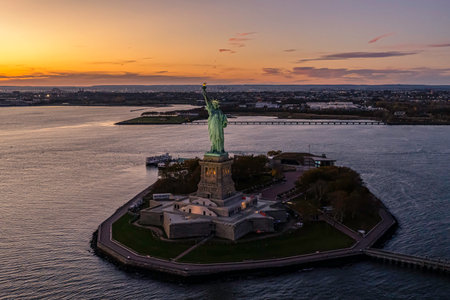 An aerial view of the Statue of Liberty during the sunset