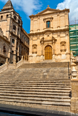 A vertical photo of building architecture in the old town of Noto on the island of Sicilyの写真素材