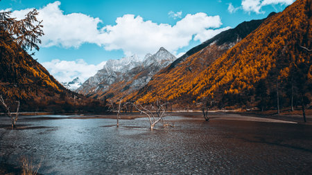 A beautiful view of a lake surrounded by rocky mountainの写真素材