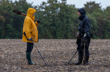 Two detectorists looking for ancient metal on the fields in Denmark