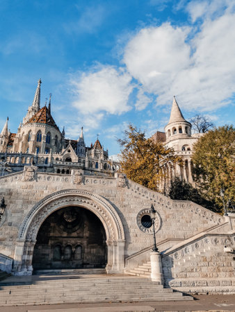 A vertical shot of Fisherman's Bastion monument in Budapest, Hungary on cloudy sky backgroundの写真素材
