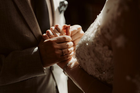 A bride and groom holding hands