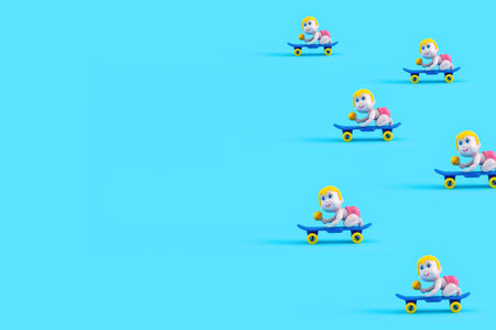 A close-up of a cut out of a baby on a skateboard toy isolated on a blue background