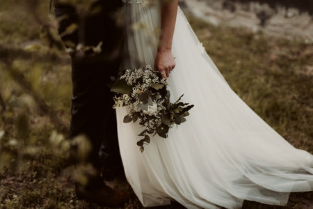A bride and groom on their wedding day during a photo sessionの写真素材