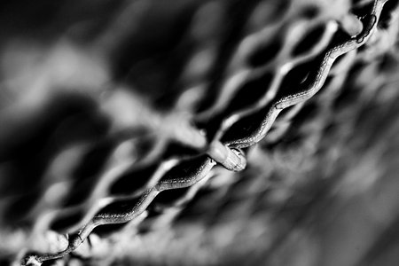 A grayscale view of steel mesh