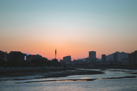 The view of the city against the sunset sky.の写真素材