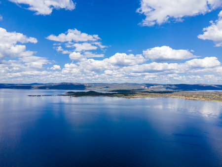 Aerial View at Copeton Dam Waters with the small lake and beautiful blue sky in Australiaの写真素材