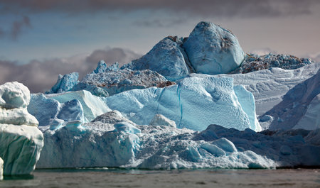 A beautiful shot of some icebergs in a sea in Greenland