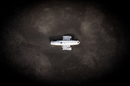 An aerial shot of an airplane wreck in Icelandの写真素材