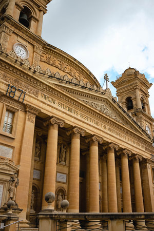 A vertical shot of an ancient building in Mosta, Maltaの写真素材