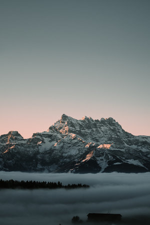 A vertical shot of the beautiful mountains in Leysin, Switzerlandの写真素材