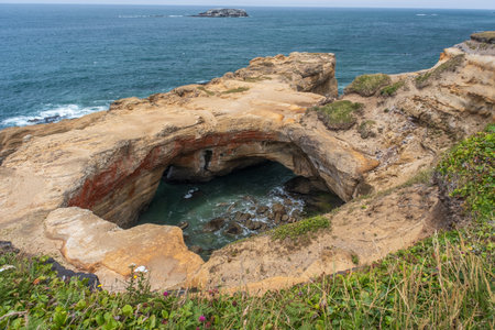 The Devil's Punchbowl natural rock formation along the Oregon coastの写真素材
