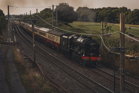 A high angle shot of a steam train on the West Coast Trainline in the UK