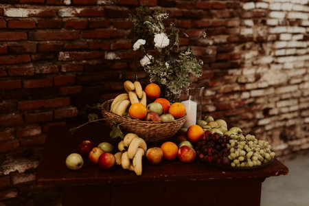 An assortment of fresh fruits on a wooden tableの写真素材