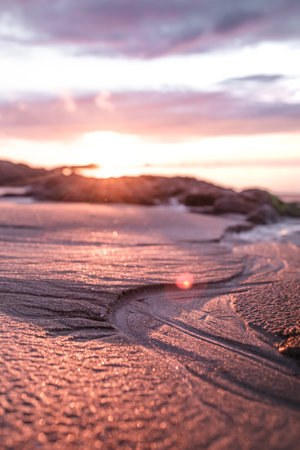 A vertical closeup of the sandy surface at sunset.の写真素材