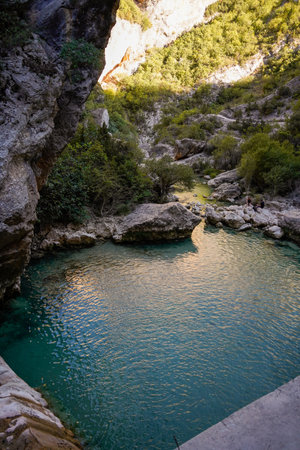 A vertical shot of a lake in the mountains