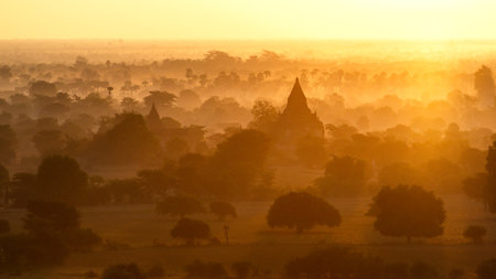 A beautiful view of ancient temples in the morning light in Myanmarの写真素材