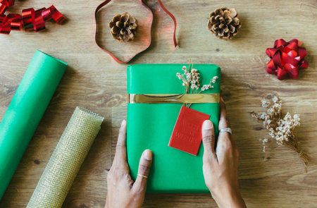 A top view of a person wrapping gifts for the holiday seasonの写真素材