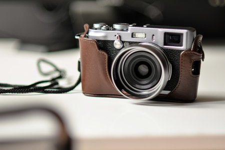 A closeup shot of a small vintage camera in leather case