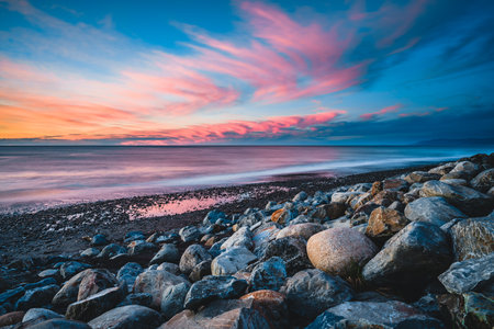 A beautiful view of a beach at sunset in New Zealandの写真素材